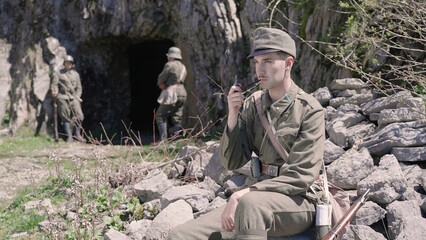 Austro-Hungarian soldier on a break light up the smoke pipe