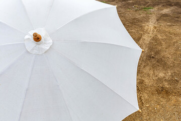 White umbrella on the floor - obrazy, fototapety, plakaty