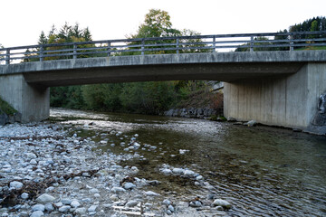 Small concrete bridge over a river in the valley