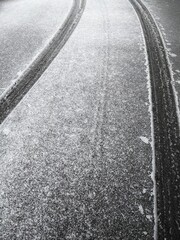 Fototapeta premium Winter road snow tire trace