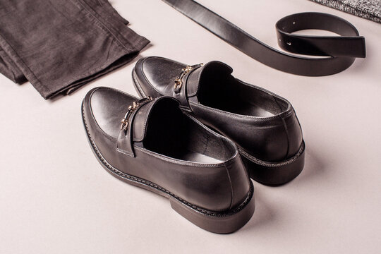 Black men shoes against gray background