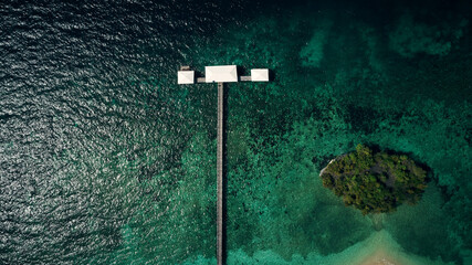A breathtaking view of the big blue. High angle shot of a pier along the island coasts of Indonesia.
