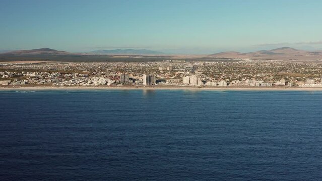 Panoramic View Of Beachfront Suburb At Blouberg Beach In Cape Town, South Africa. Aerial Wide Shot