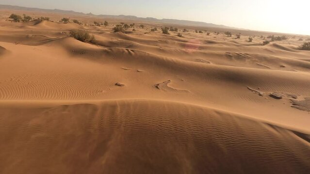 Cinematic aerial drone fpv over sandy dunes of Morocco desert