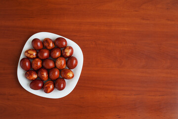Easter time. Traditional handmade Easter eggs on table. Copy space