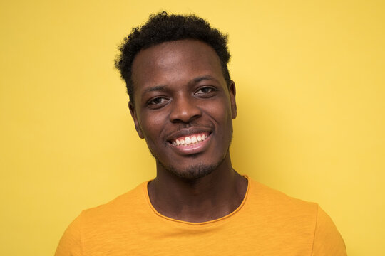 Smiling african man ooking at camera. Portrait of black confident man.