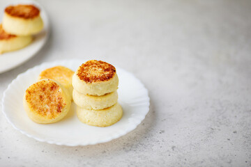  breakfast in the form of cottage cheese pancakes on a plate