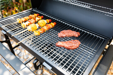 Delicious grilled meat mixed with vegetables on the BBQ grill