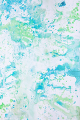 watercolor spots of yellow and blue on a white background. texture. bright spots and splashes of paint on the paper. 