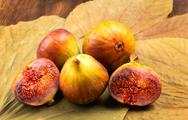 Freshly ripe figs. Healthy Mediterranean fig fruit. Fresh figs on a dark background. Beautiful blue...