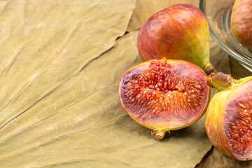Freshly ripe figs. Healthy Mediterranean fig fruit. Fresh figs on a dark background. Beautiful blue...