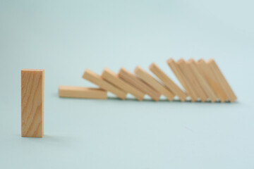 Fallen wooden blocks. The concept of business leadership