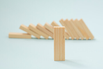 Fallen wooden blocks. The concept of business leadership