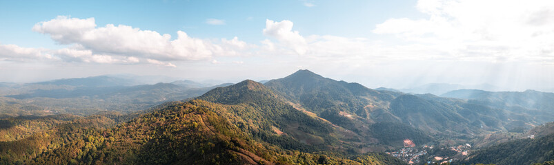 high angle view of forest and mountains in summer