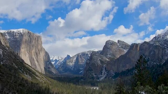 A time lapse of Tunnel View in Yosemite National park in winter from the Tunnel View Overlook. The clouds move overhead, casting shadows on the valley below.