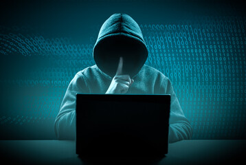 faceless hooded hacker showing silence gesture. Cyber attack, system breaking and malware. Internet...