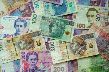 Paper money, Ukrainian hryvnia and Polish zloty. Currency exchange for refugees and emigrants from Ukraine.