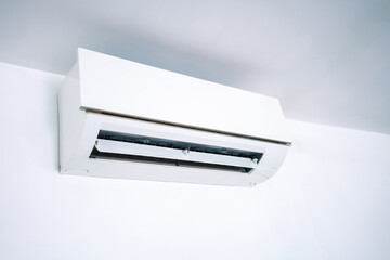 Air conditioner on white wall background.