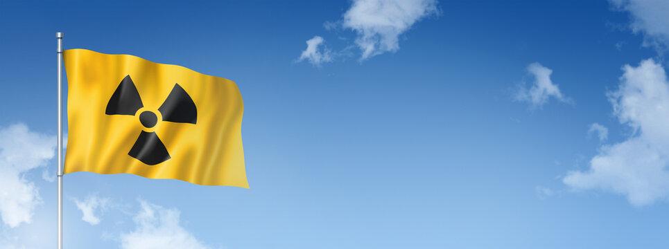 radioactive nuclear symbol flag isolated on a blue sky. Horizontal banner