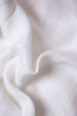 White crumpled linen fabric texture background. Natural linen canvas organic eco textiles background. Top view