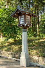 Japanese traditional  lantern, called 'Toro' in a park on the way to a Shinto Shrine in Shibuya, Tokyo, Japan