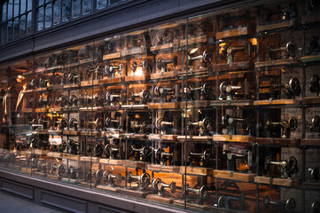 showcase with vintage sewing machines on display