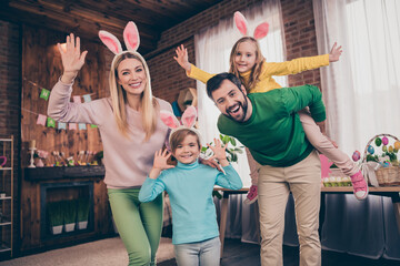Portrait of attractive cheerful big full family spending vacation having fun easter party preparation indoors