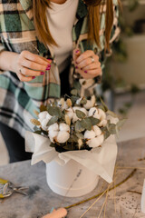 Floristic master class. Composition of dried flowers, cotton and eucalyptus