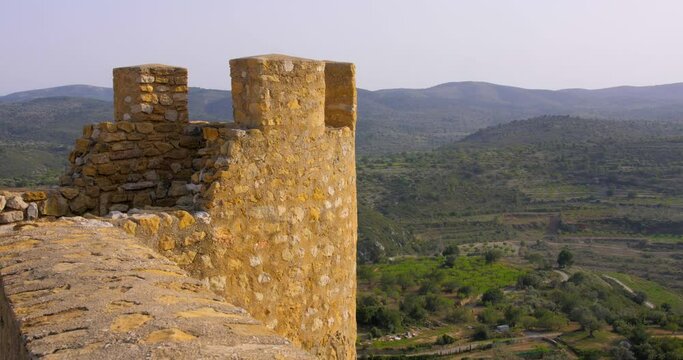 Static view of remains of an old medieval castle tower of a hill in Cervera del Maestre, Castellon province, Spain. 4K.