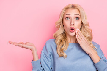 Photo of young impressed girl demonstrate promotion product decision isolated over pink color background