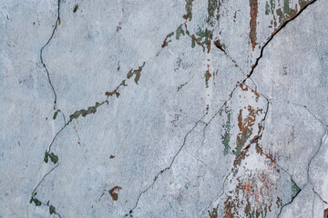 Old shabby cracked gray wall background.