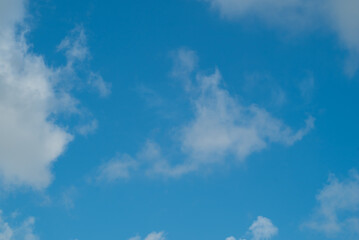 Naklejka na ściany i meble Blue Sky With White Puffy Clouds On A Sunny Day