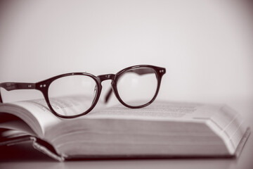 reading glasses on the book
