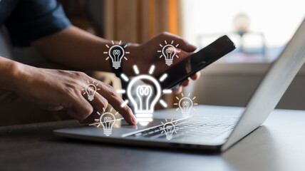 Idea for a light bulb theme with a laptop computer user