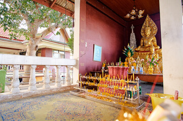 Buddha temple with a golden Buddha statues in inside,a view from outdoorr.