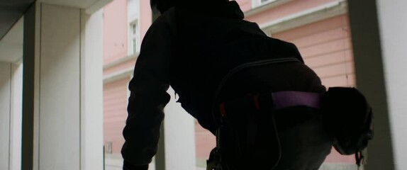 TRACKING Young Caucasian male commuting on his vintage fixed gear bicycle through the city