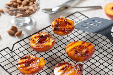Healthy dessert juicy barbecue peaches with peaches ice cream on the grill