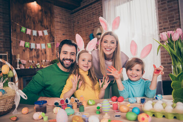 Photo of full beautiful family prepare easter eggs hands paint have fun festive atmosphere house indoors