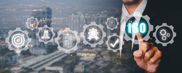 ISO standards quality control concept, Person hand pointing gear with VR screen iso icon background, Assurance warranty, Business technology concept...