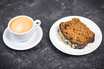 Fresh baked pastry made of zucchini and cup of white coffee. Delicious dessert