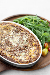 fresh beef lasagna in oven dish on table in rome italy restaurant