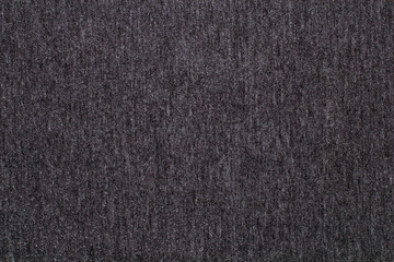 Black knitted fabric cotton textured background. Closeup with copy space for your design