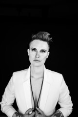 Woman headshots in a white suit black and white 