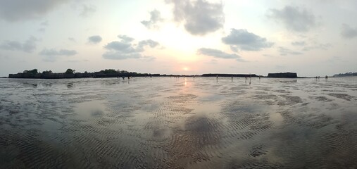 sunset over the sea side castle fort 