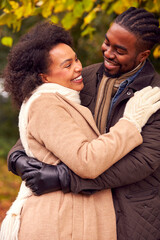 Fototapeta premium Loving Couple On Walk Through Autumn Countryside Together