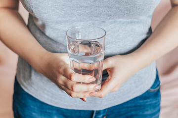 World Water Day. Woman holds glass of clean water in her hands. Health care concept.