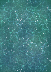 An illustrated texture background with speckles and ocean water ripples in green and blue