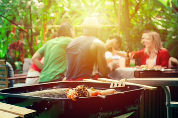 barbecue party.Happy friends with barbecue party in nature.