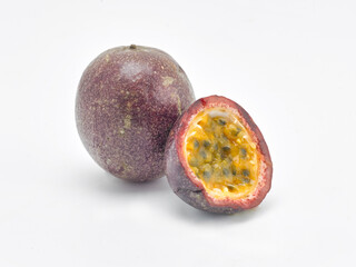 Passion Fruit and a sliced fruit on a white background