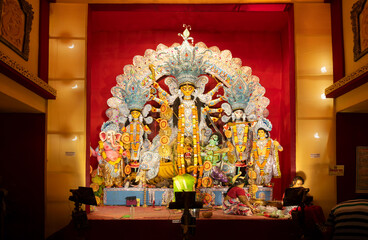 Fototapeta premium Kolkata, India - October 16, 2018 : Night image of decorated Durga Puja pandal, shot at colored light, at Kolkata, West Bengal, India. Durga Puja is biggest religious festival of Hinduism.